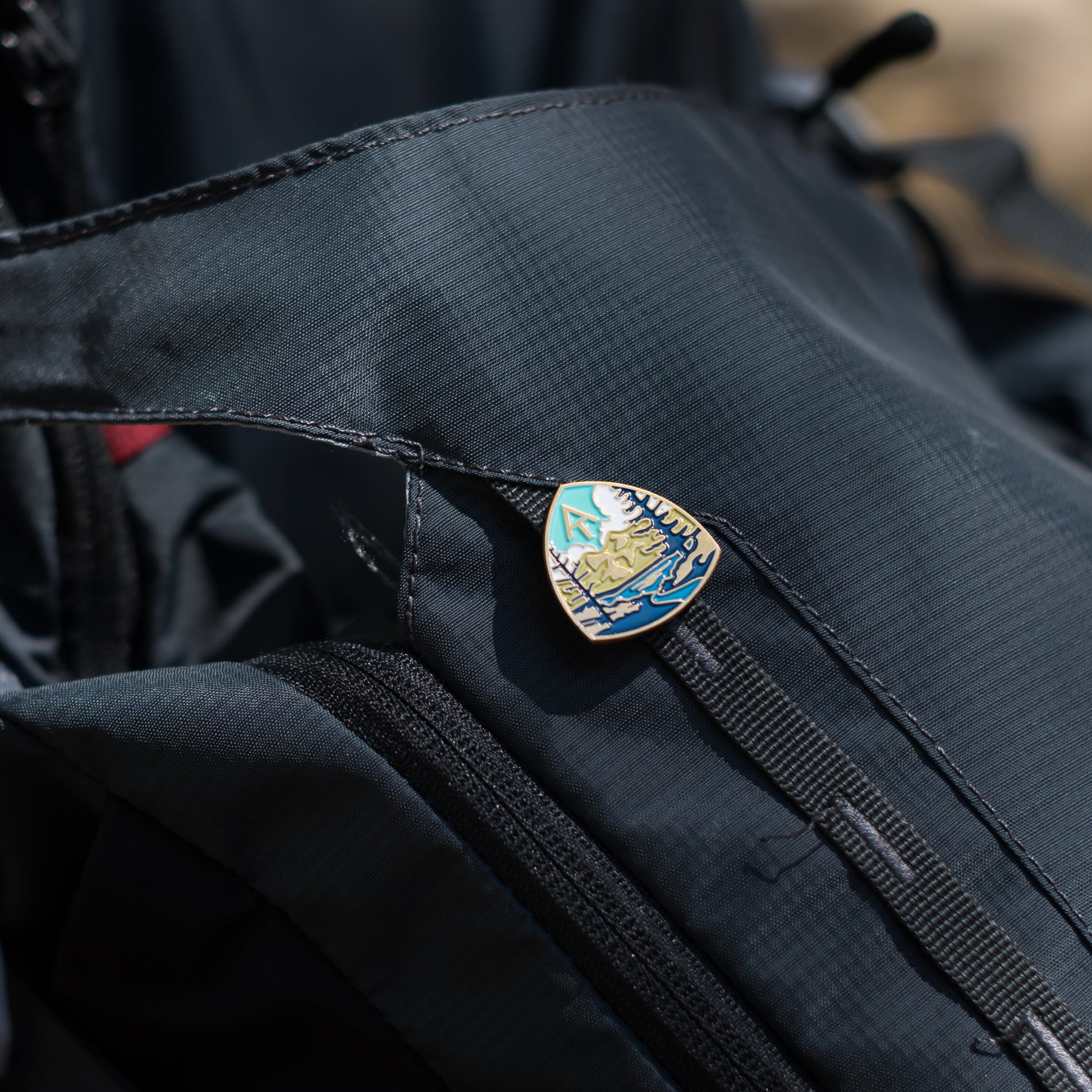 Appalachian Trail enamel pin on bag